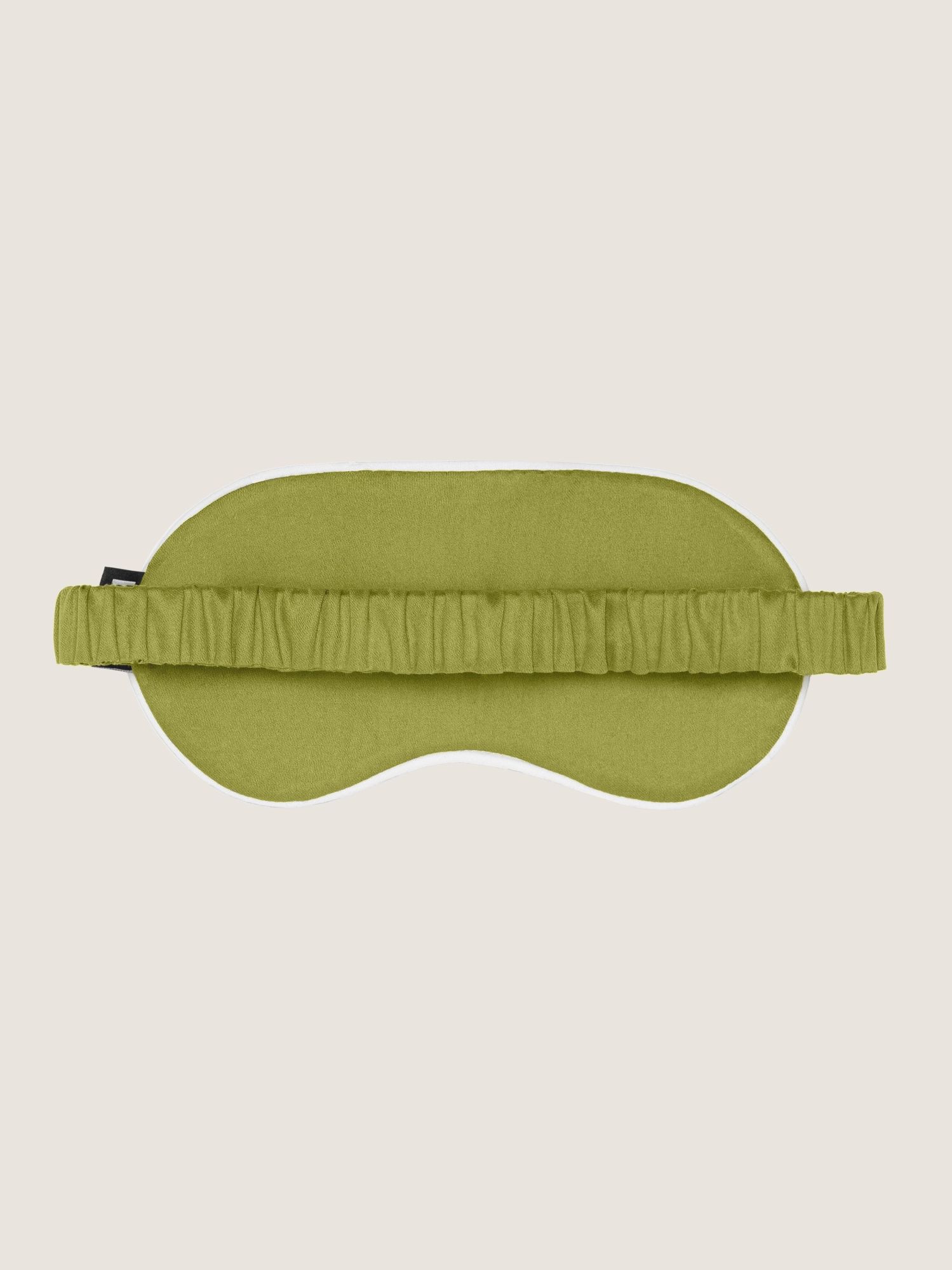 Сатинова маска для сну Bises Dreamline у відтінку Pistachio Green зі зворотного боку, з еластичною стрічкою та молочним кантом